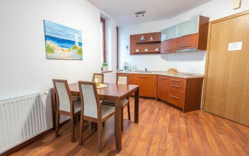 Apartamenty Salon - R�?a Wiatr�w