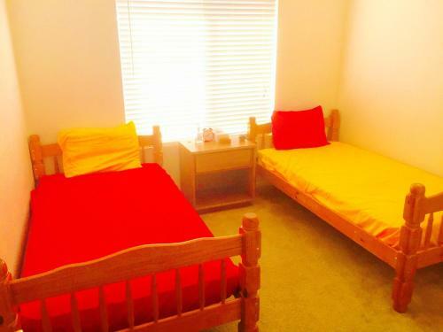 Bed & Breakfast Red Orange Yellow Guest Room