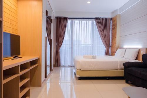 Comfy Studio At Dago Suites Apartment By Travelio
