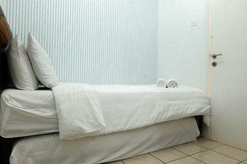 2br Pino Green Pramuka Apartment By Travelio