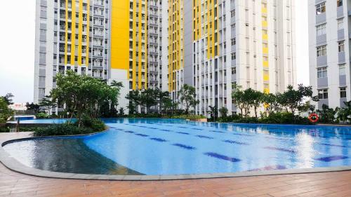 Homey Studio @springlake Summarecon Apartment By Travelio