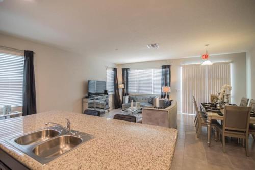 Glamorous 4 Bedroom 3.5 Bath End Unit Town Home Located In Compass Bay