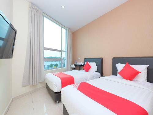 Hostal Oyo 89493 Q Hotel