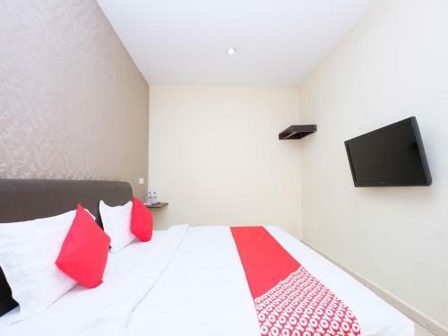 Hostal Oyo 89493 Q Hotel