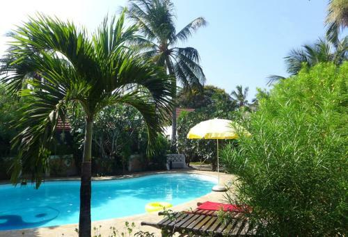 Apartamento Frangipani Cottages