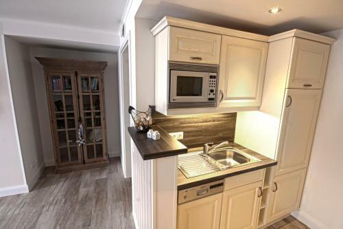 Apartamento Ferienwohnung "b�sumer Reethus"