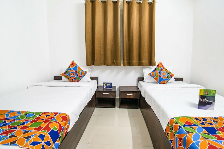 Fabhotel Purple Orchid