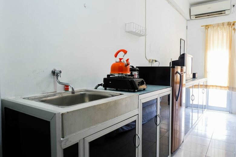 Homey Studio Puri Mas Apartment