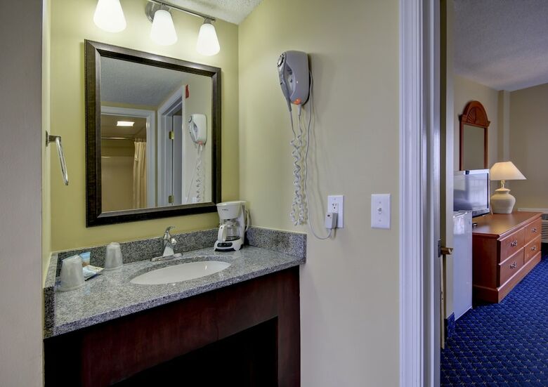 Apartamento Coastal Palms Inn & Suites