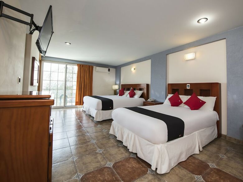 Hotel Capital O Suites de Reyes
