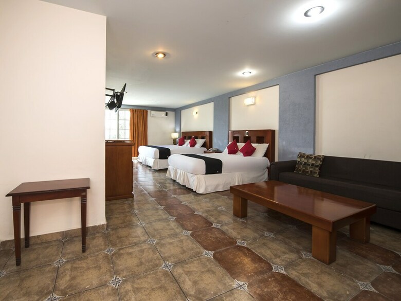 Hotel Capital O Suites de Reyes
