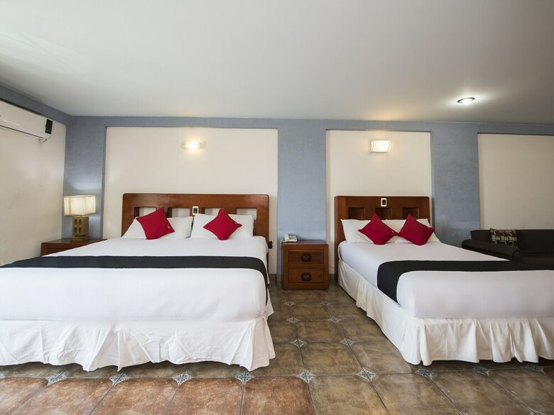 Hotel Capital O Suites de Reyes