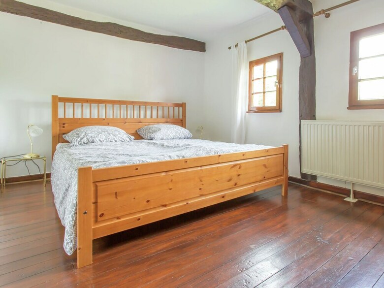 A Lovely Watermill Surrounded By Delightful Greenery