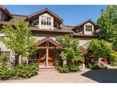 Tranquil Chateau Golf Course Setting By Harmony Whistler