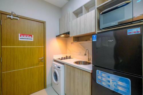 Homey And Warm Studio Apartment Oasis Cikarang By Travelio