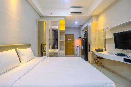 Homey And Warm Studio Apartment Oasis Cikarang By Travelio