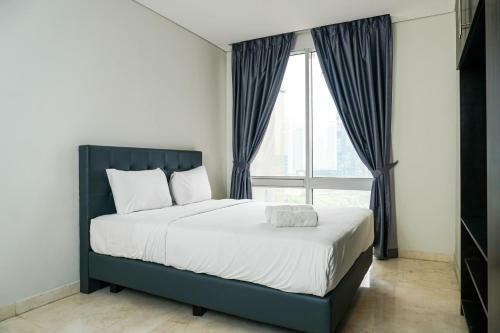 Spacious And Elegant 2br @ The Masterpiece Apartment By Travelio
