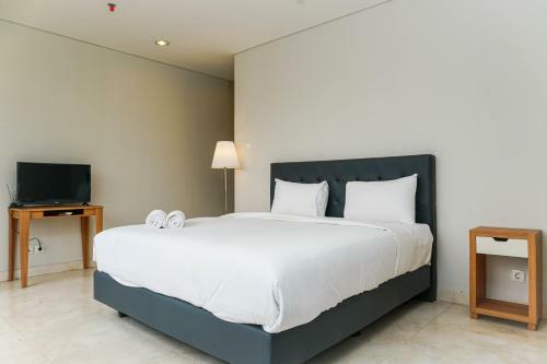 Spacious And Elegant 2br @ The Masterpiece Apartment By Travelio