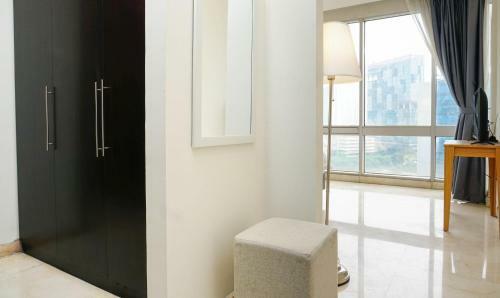 Spacious And Elegant 2br @ The Masterpiece Apartment By Travelio