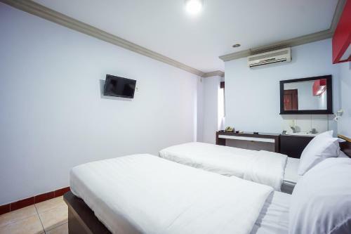 Capital O 3433 Hotel Plaza