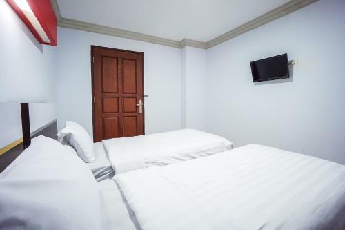 Capital O 3433 Hotel Plaza