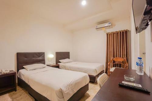 Capital O 3433 Hotel Plaza
