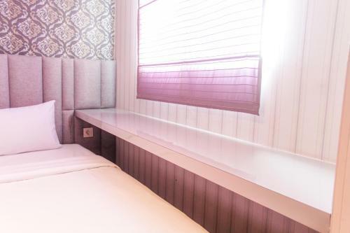 Minimalist And Cozy Studio Bintaro Icon Apartment By Travelio