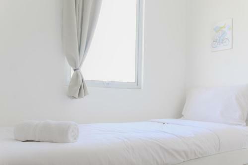 Comfortable 2br At Emerald Bintaro Apartment By Travelio