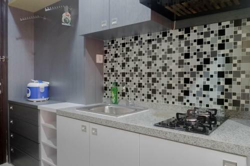 Relaxing Studio Apartment At Tamansari Papilio By Travelio