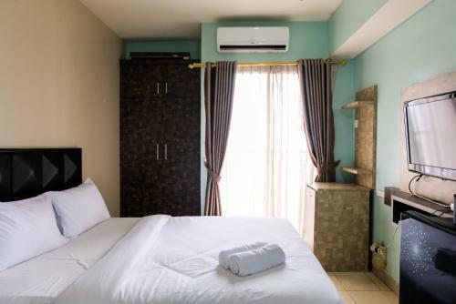 Minimalist Studio At Serpong Greenview Apartment By Travelio