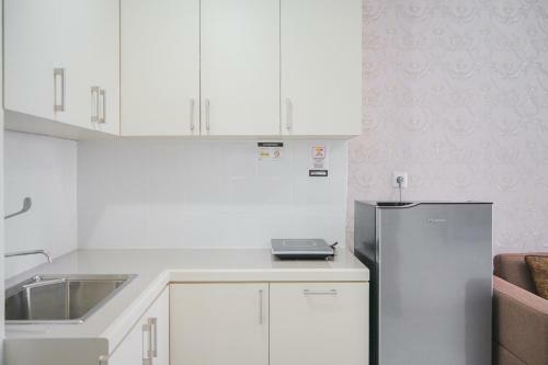 Minimalist 2br At Emerald Bintaro Apartment By Travelio
