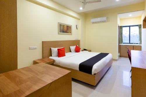 Hotel Capital O 67372 Garuda Suites