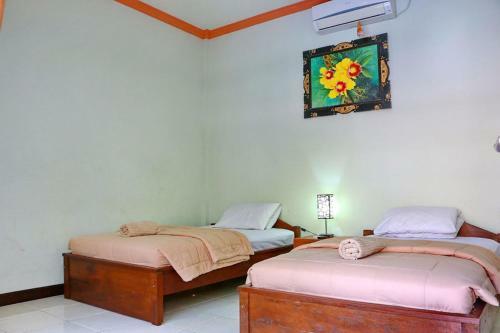 Hotel Taxa Inn Kuta Raya