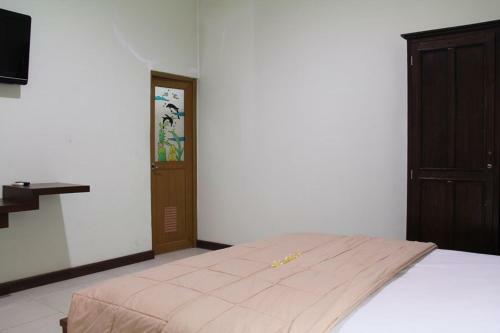 Hotel Taxa Inn Kuta Raya