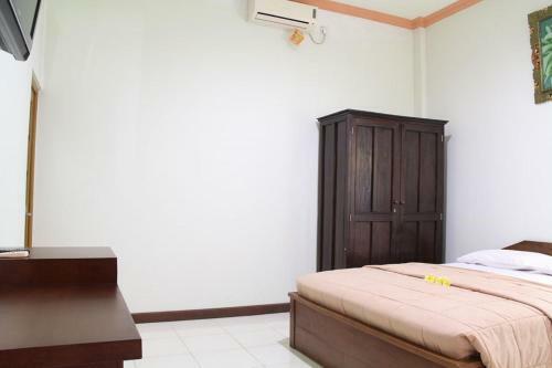 Hotel Taxa Inn Kuta Raya