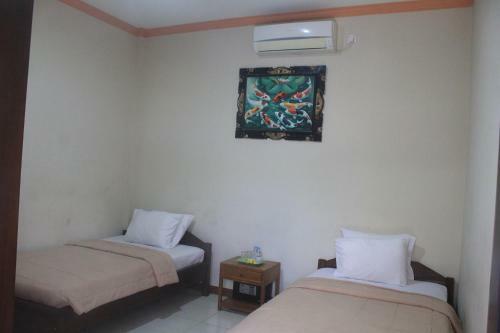 Hotel Taxa Inn Kuta Raya