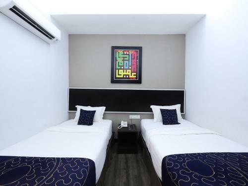 Capital O 978 Midaris Hotel