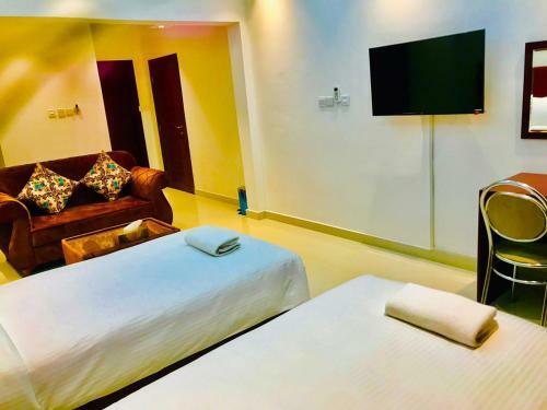 Apartamento Aljawhara Inn Hotel