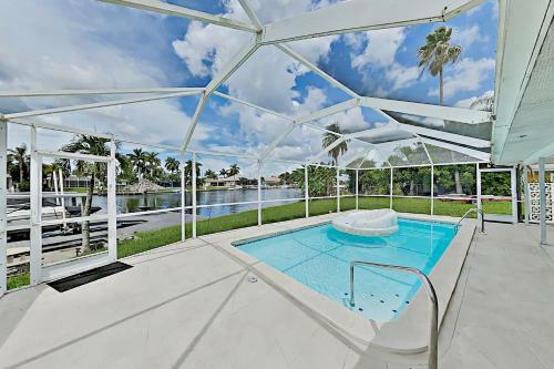 Canal-front Getaway With Heated Pool & Dock Home