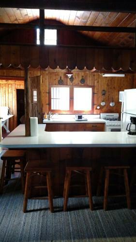 Log Cottage On Blue Lake