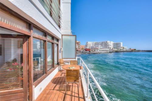 House Touching The Sea