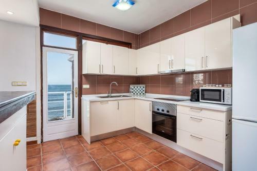 House Touching The Sea