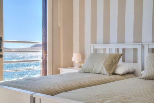 House Touching The Sea