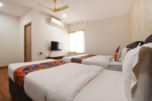 Fabhotel Dhanvitha Suites