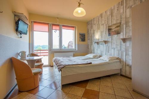 Domino - Pokoje I Apartamenty