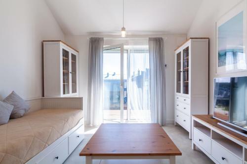 White Sand Apartment With A Balcony, By Cohost