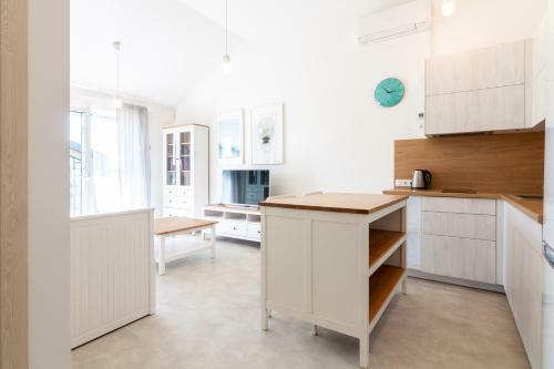 White Sand Apartment With A Balcony, By Cohost