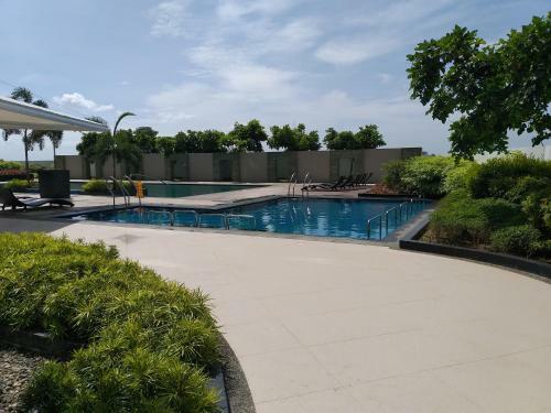 Apartamento Mactan Newtown With Sun Set And Garden View