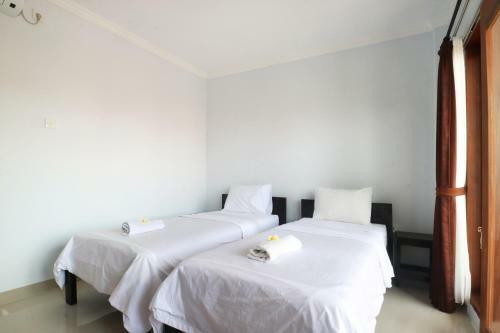 Hostal The Wina Echo Beach Guest House