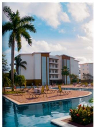 Apartamento Poseidon's Beachfront Sanctuary